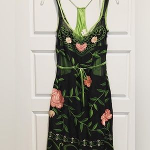 Lined dress with exceptional quality. Embroidery is unique to the dress.